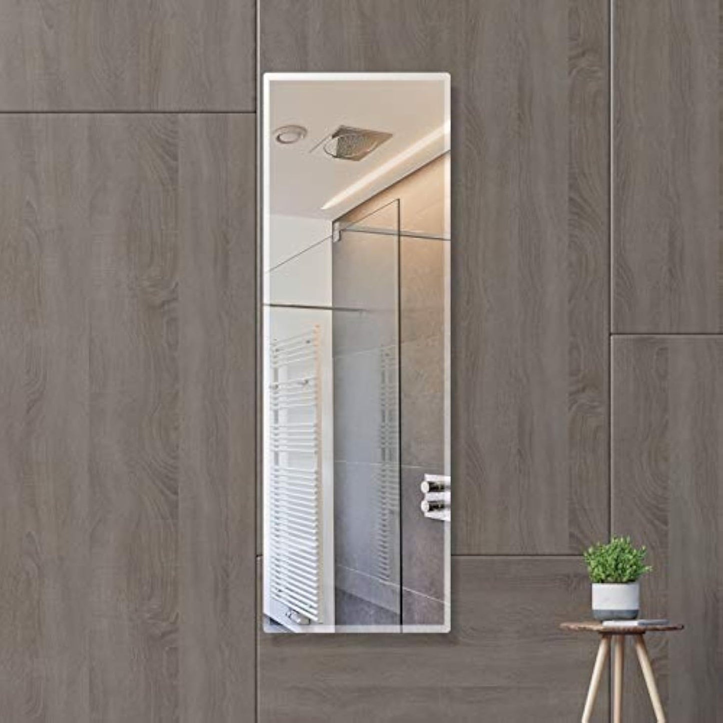 Frameless 5mm HD wall mirror with beveled smooth edges; a sleek rectangular design perfect for bathroom or home décor with clear, sharp reflection