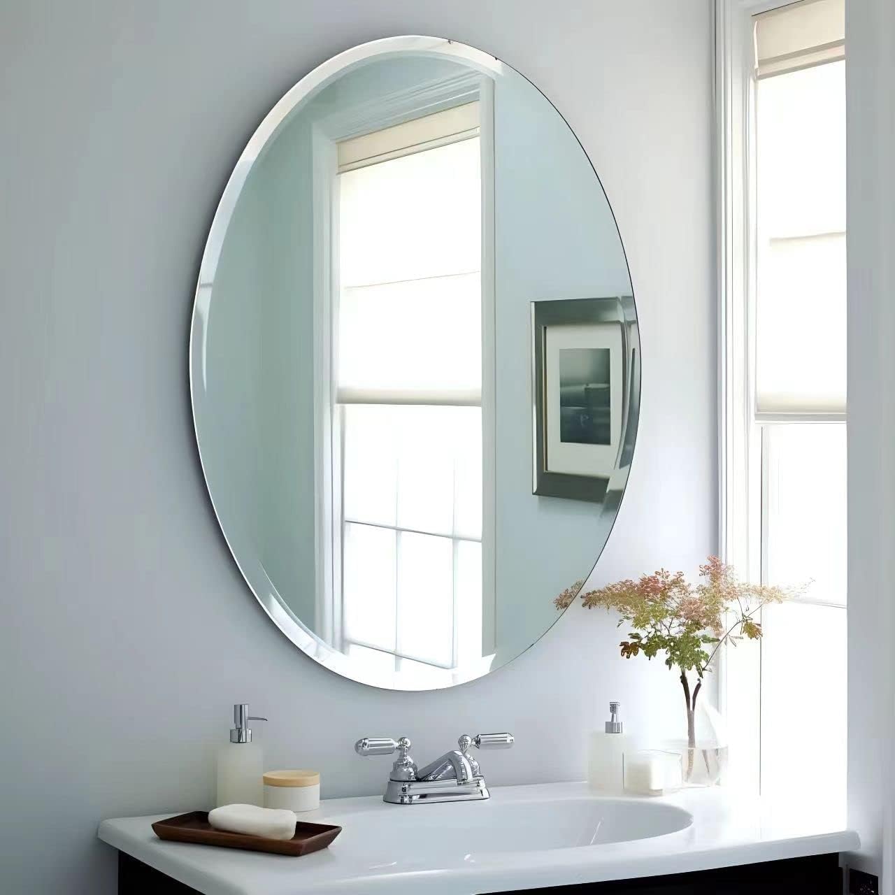 Frameless HD Oval mirror with beveled smooth edges and wall mount design; adds a clear, modern elegance to any home décor or living space
