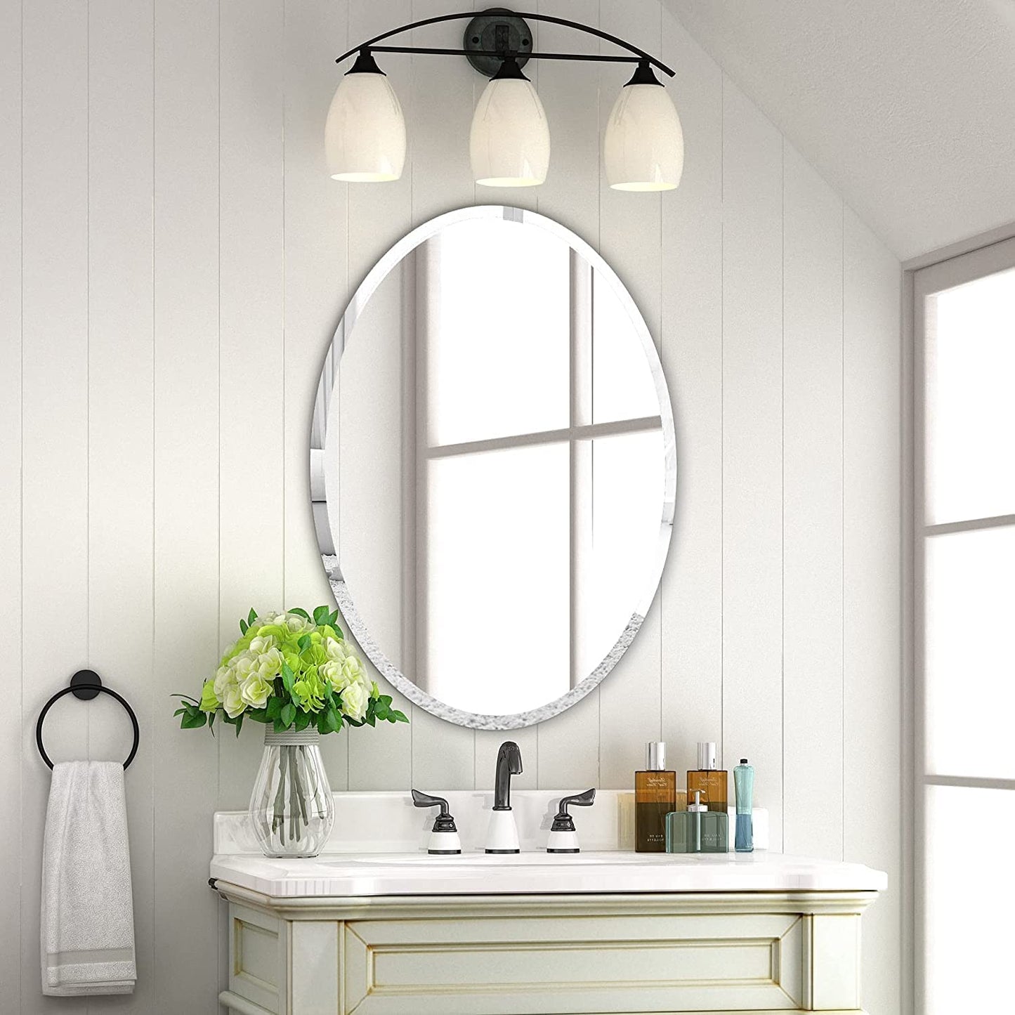 Frameless HD Oval mirror with beveled smooth edges and wall mount design; adds a clear, modern elegance to any home décor or living space