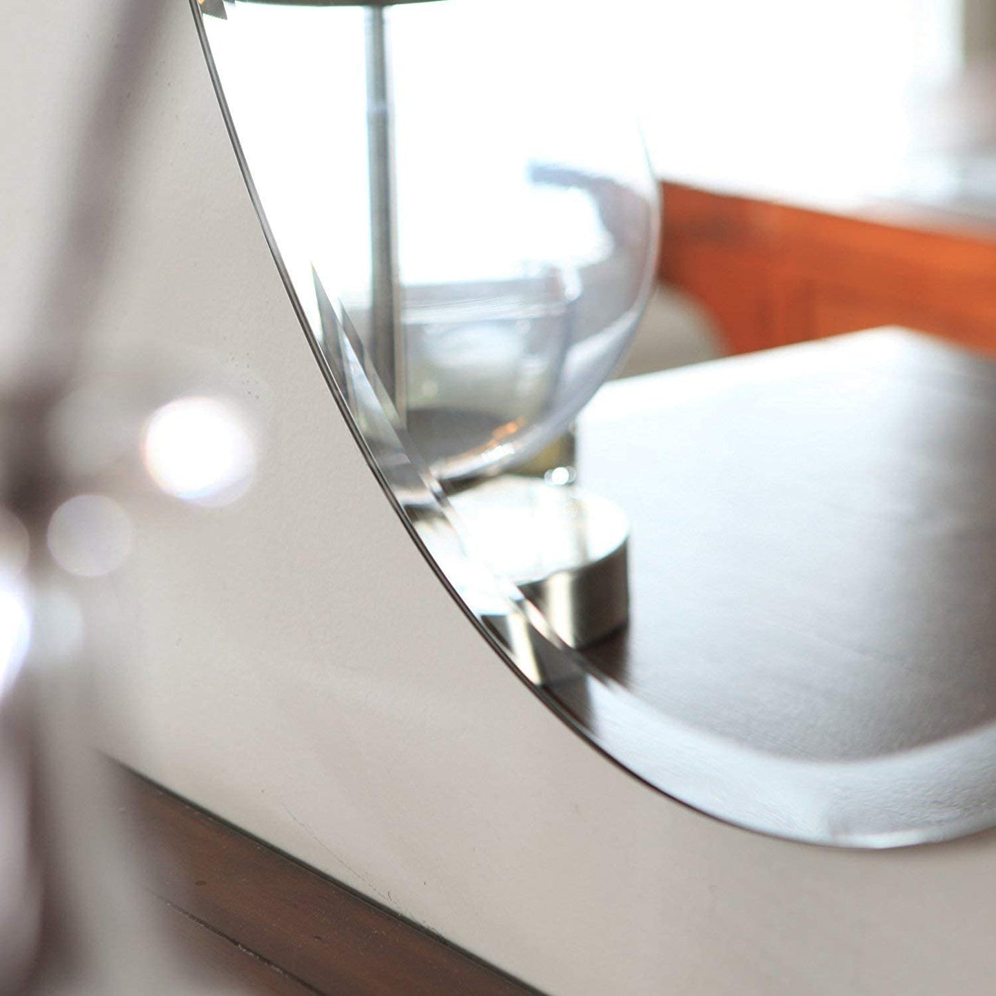 Frameless HD Oval mirror with beveled smooth edges and wall mount design; adds a clear, modern elegance to any home décor or living space